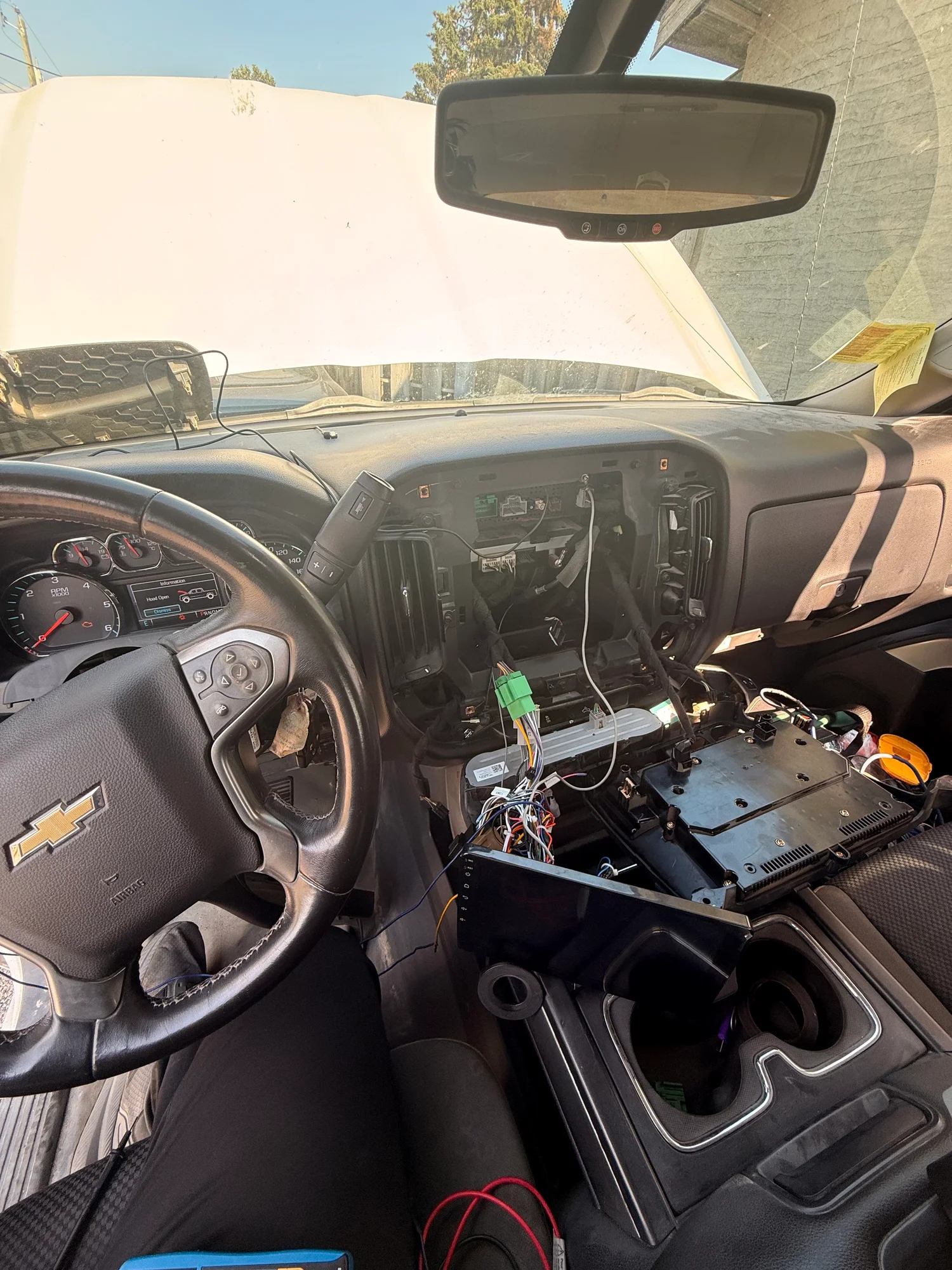 2015 Chevy Silverado dashboard opened during wiring diagnosis before ultra-wide CarPlay screen installation