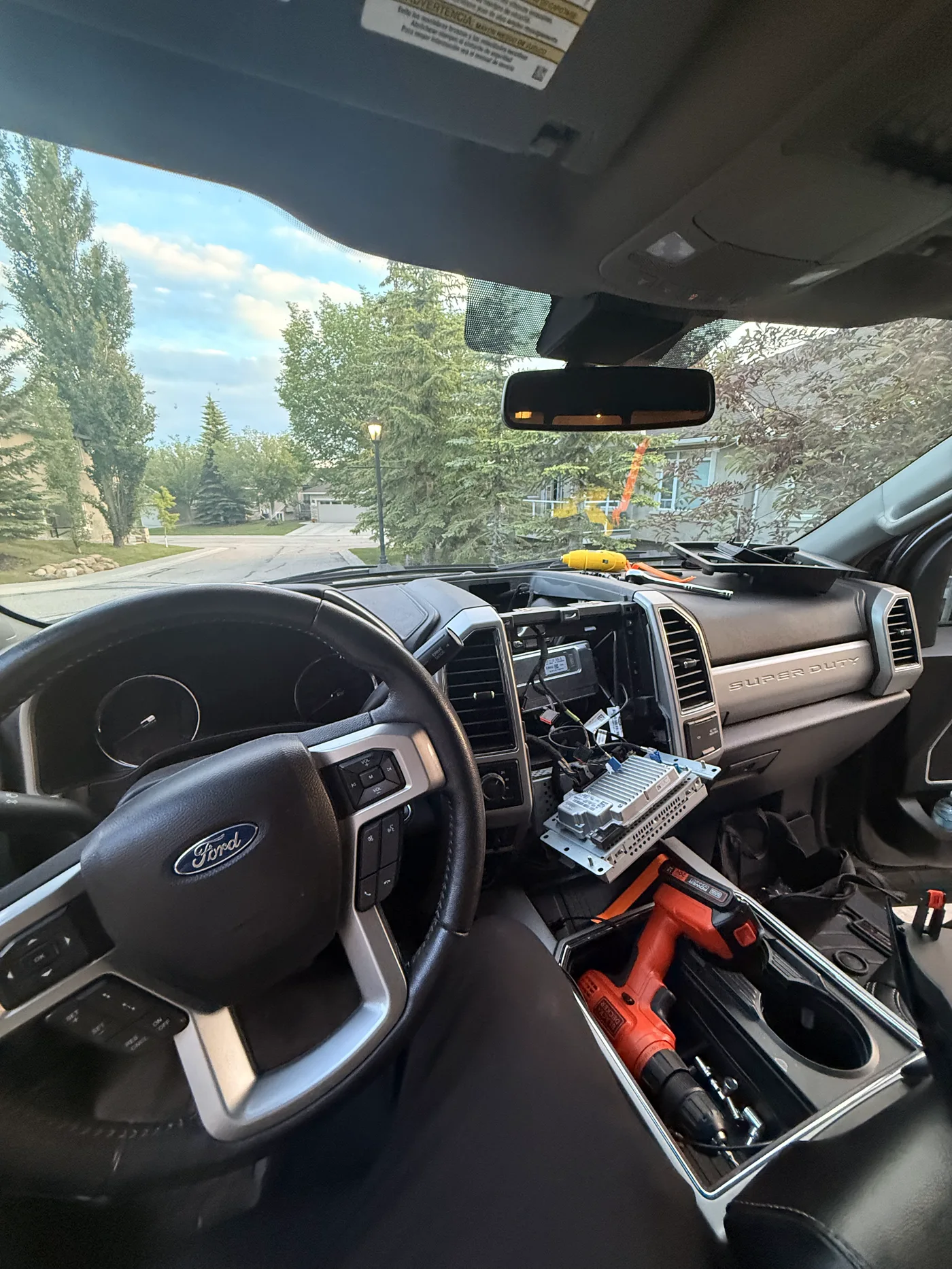 2018 Ford F-350 Super Duty dashboard opened during screen installation preparation in Calgary