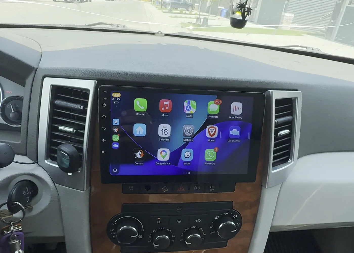 2009 Jeep Grand Cherokee CarPlay screen and backup camera installation in Calgary